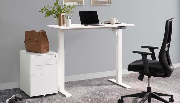 varidesk essential electric standing desk in office setting